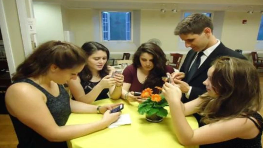 young-people-texting-smartphones-using-thumbs.jpg